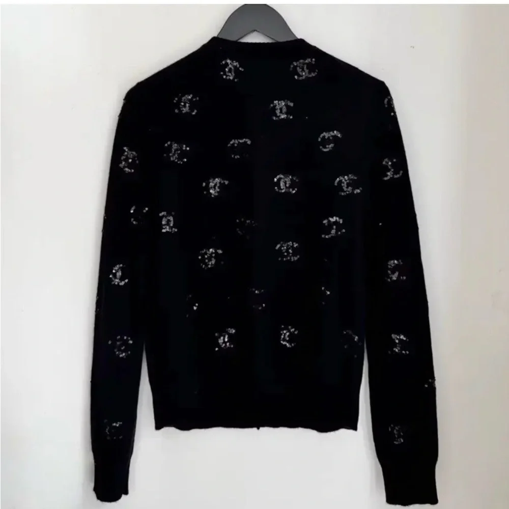 CHANEL Black Cardigan with Pink Floral Motif. 2024, 100% Cashmere, FR 36, US S